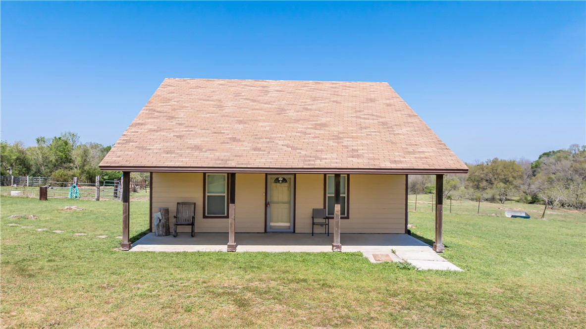 5732 Rose Hill Road Calvert, TX 77837 - Photo 2 of 46 a view of a house with backyard porch and garden