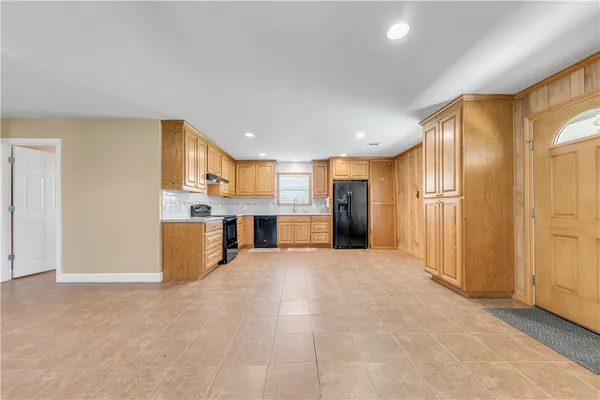 a view of a kitchen with a sink and cabinets