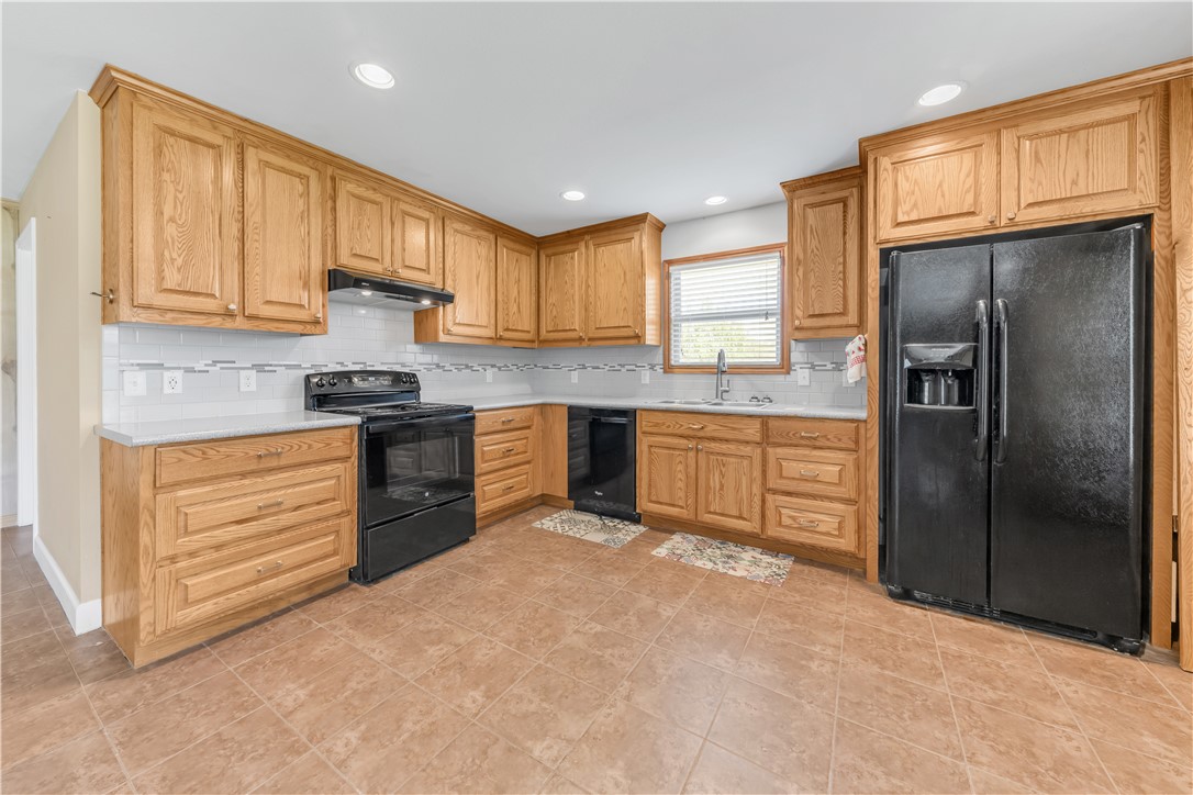 5732 Rose Hill Road Calvert, TX 77837 - Photo 8 of 46 a kitchen with stainless steel appliances granite countertop a refrigerator sink and cabinets