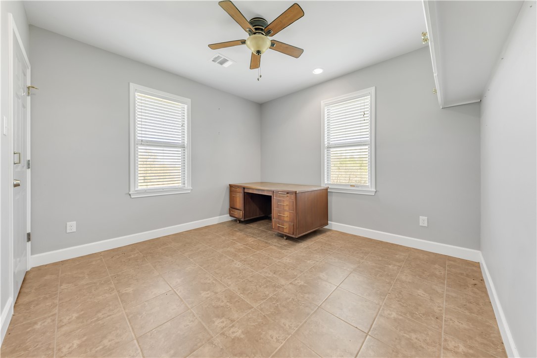 5732 Rose Hill Road Calvert, TX 77837 - Photo 9 of 46 an empty room with windows and ceiling fan