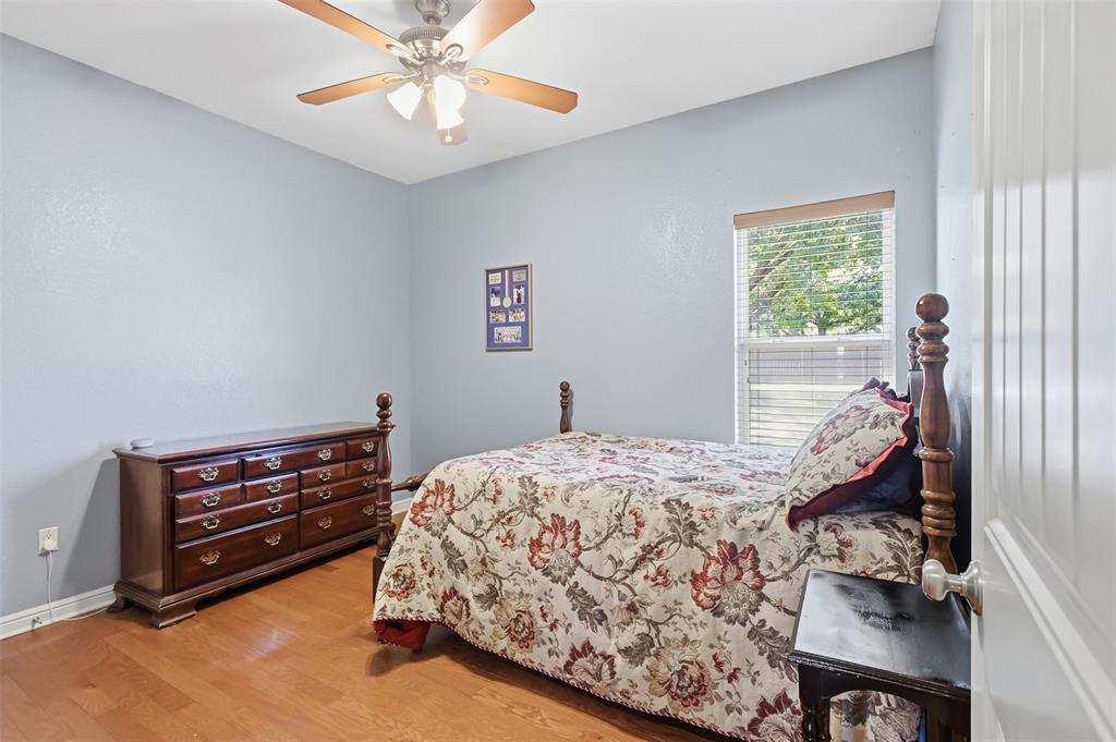 207 Dennis Road Lipan, TX 76462 - Photo 24 of 40 Wood-finish flooring with a ceiling fan and overhead lighting
