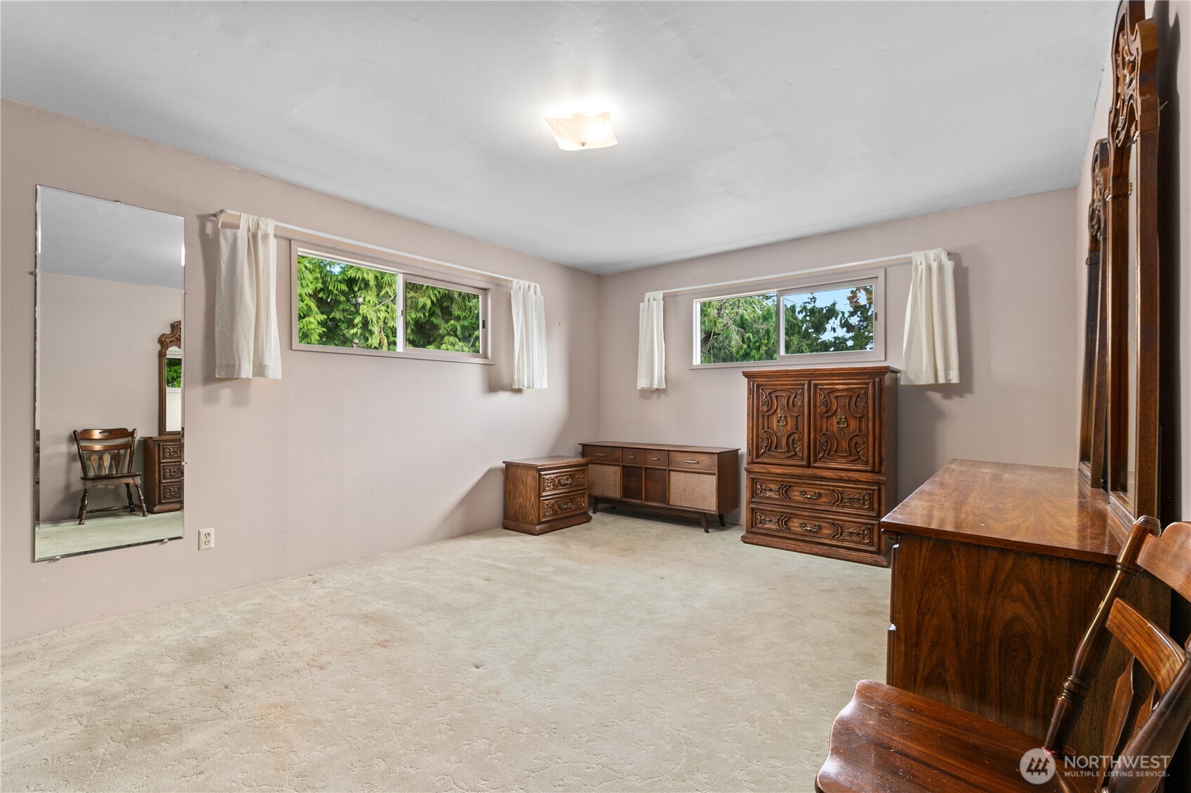 9112 Axling Road Lynden, WA 98264 - Photo 13 of 38 a bedroom with furniture and a flat screen tv