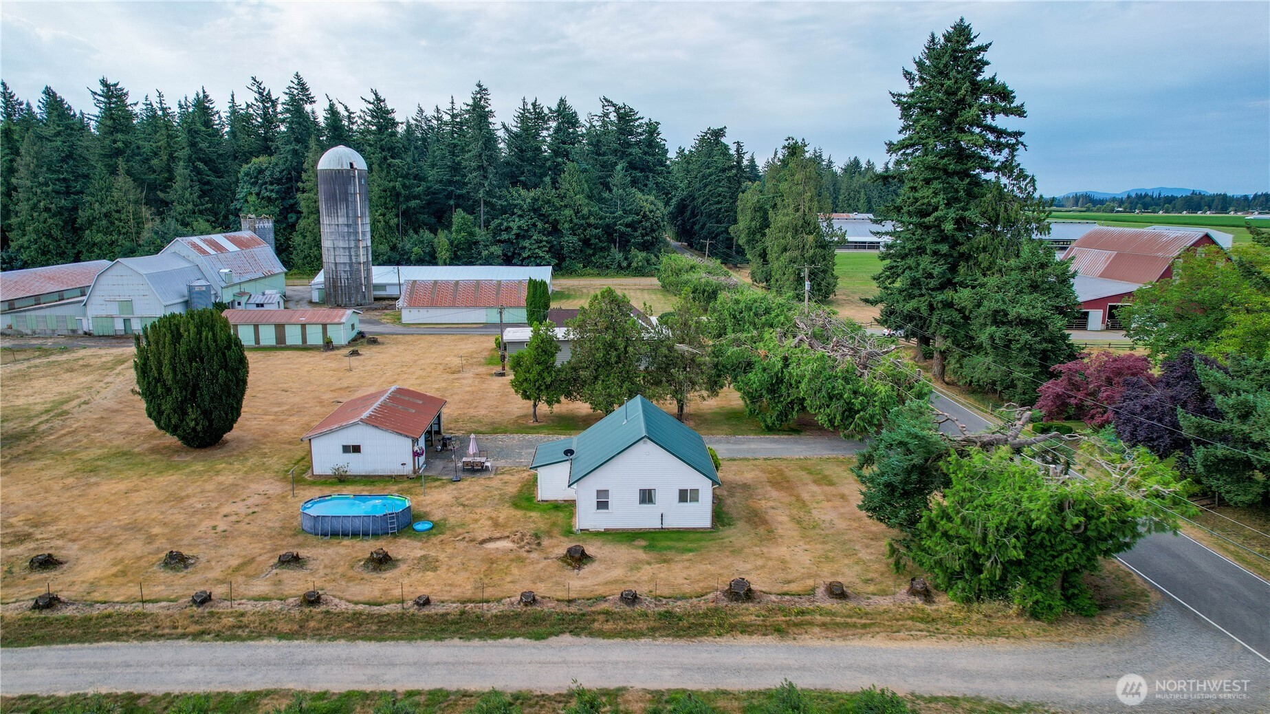 9112 Axling Road Lynden, WA 98264 - Photo 35 of 38 an aerial view of a house with garden space and lake view