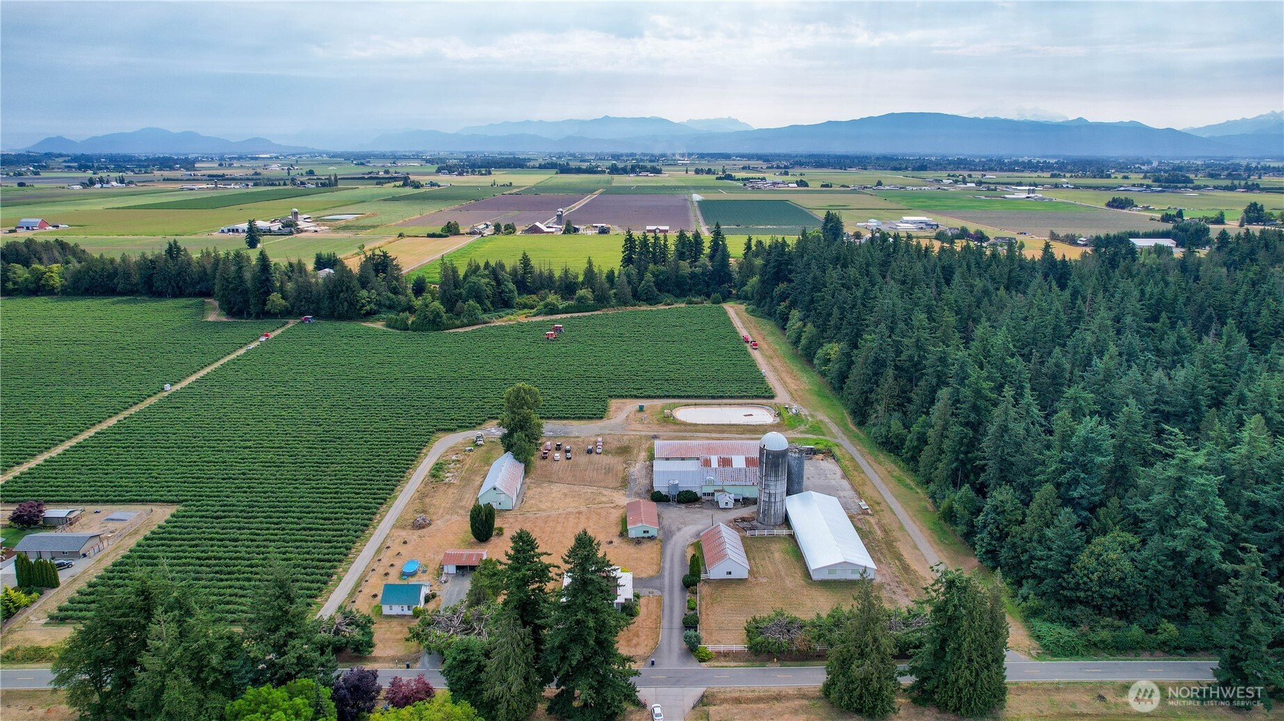9112 Axling Road Lynden, WA 98264 - Photo 38 of 38 an aerial view of a house with garden space and outdoor seating