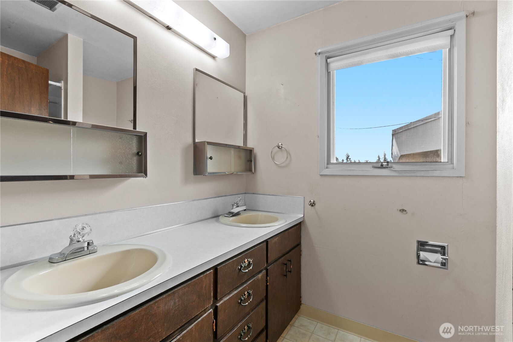 9112 Axling Road Lynden, WA 98264 - Photo 9 of 38 a bathroom with a sink and a mirror