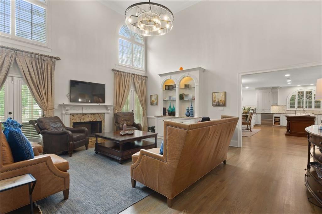 415 Lyerly Pointe Alpharetta, GA 30022 - Photo 13 of 62 a living room with fireplace furniture and a flat screen tv