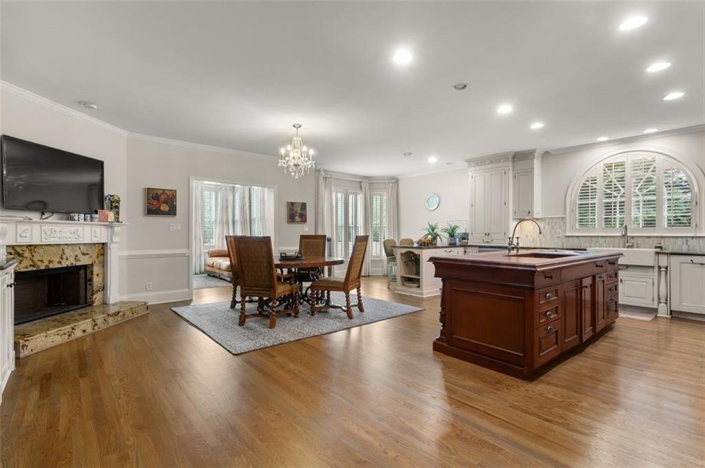 415 Lyerly Pointe Alpharetta, GA 30022 - Photo 18 of 62 a living room with furniture a fireplace and a flat screen tv