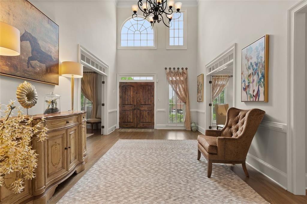 415 Lyerly Pointe Alpharetta, GA 30022 - Photo 6 of 62 a living room with furniture and a fireplace