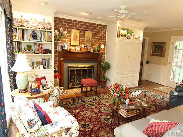 8805 Lomas Court Raleigh, NC 27615 - Photo 10 of 25 The family room features wonderful bookcases, built in TV cabinet and cozy gas logs for those chilly evenings! Den/Family/Great Room