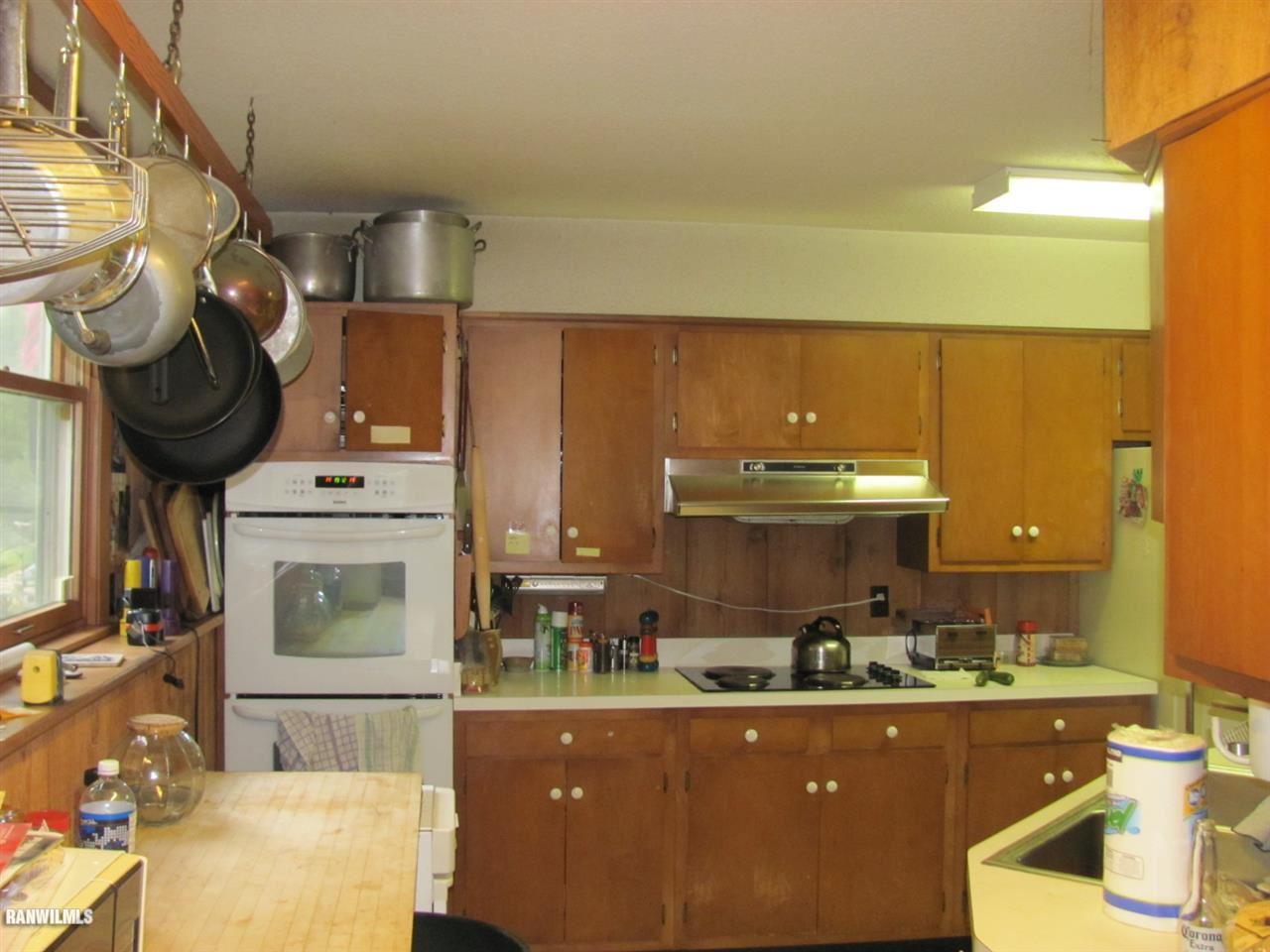 4302 South Blanding Road Hanover, IL 61041 - Photo 3 of 22 a kitchen with table and chairs