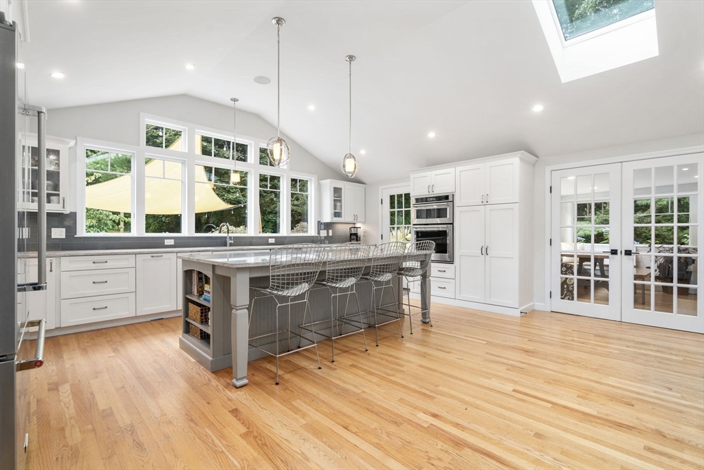 1 Sedgemeadow Road Wayland, MA 01778 - Photo 6 of 42 a kitchen with stainless steel appliances granite countertop a stove and a wooden floors