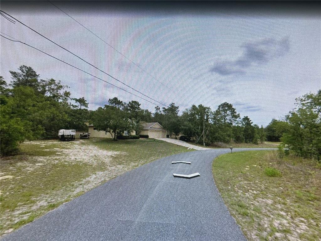 2466 West Swanson Drive Citrus Springs, FL 34434 - Photo 7 of 19 a view of a lake with houses