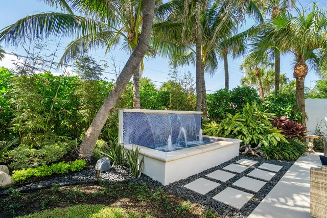 a view of a house with a yard and garage
