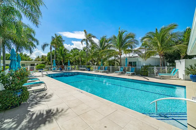 a living room with furniture gym equipment and a floor to ceiling window