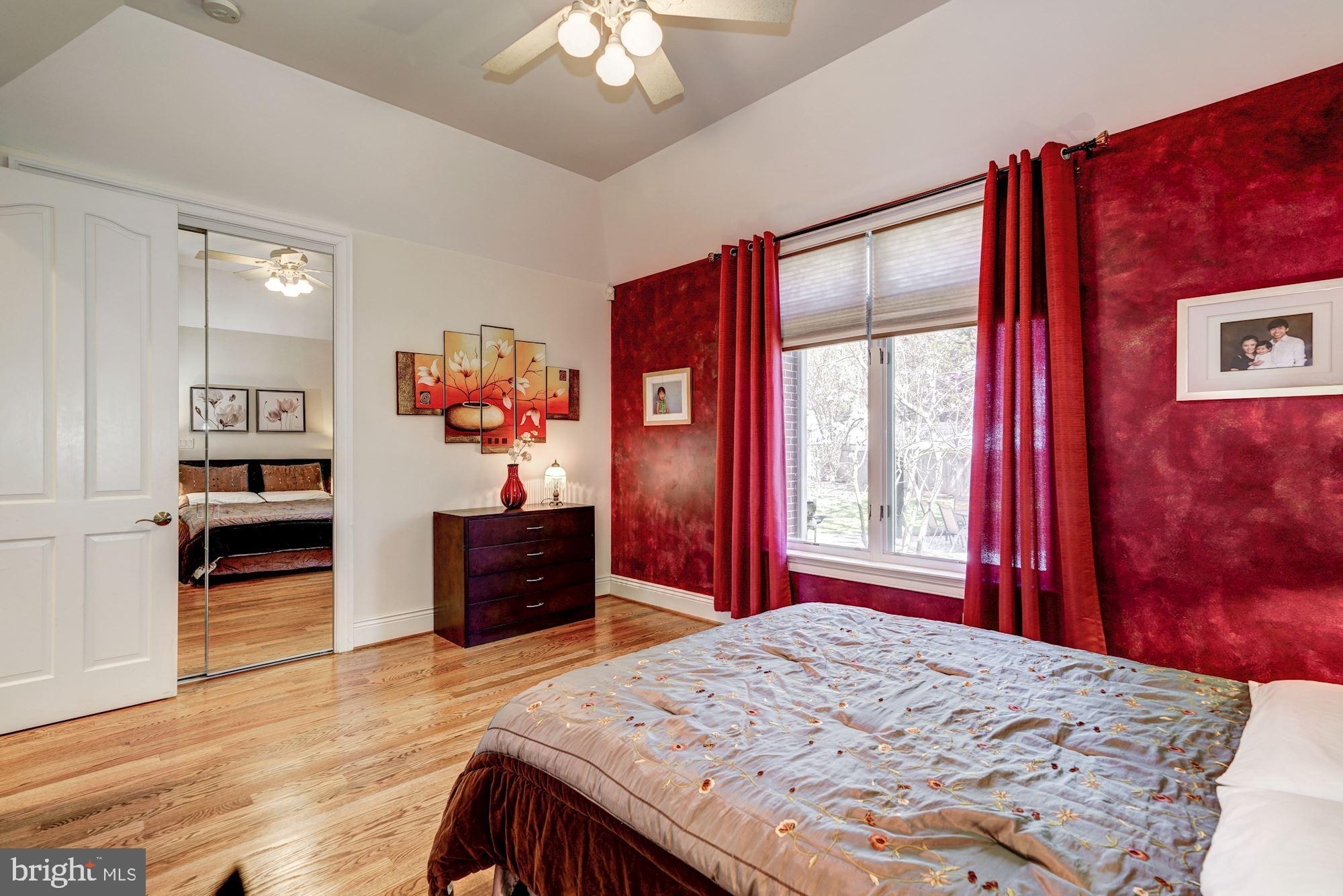3809 Jones Bridge Road Chevy Chase, MD 20815 - Photo 16 of 70 a bedroom with a bed and a dresser