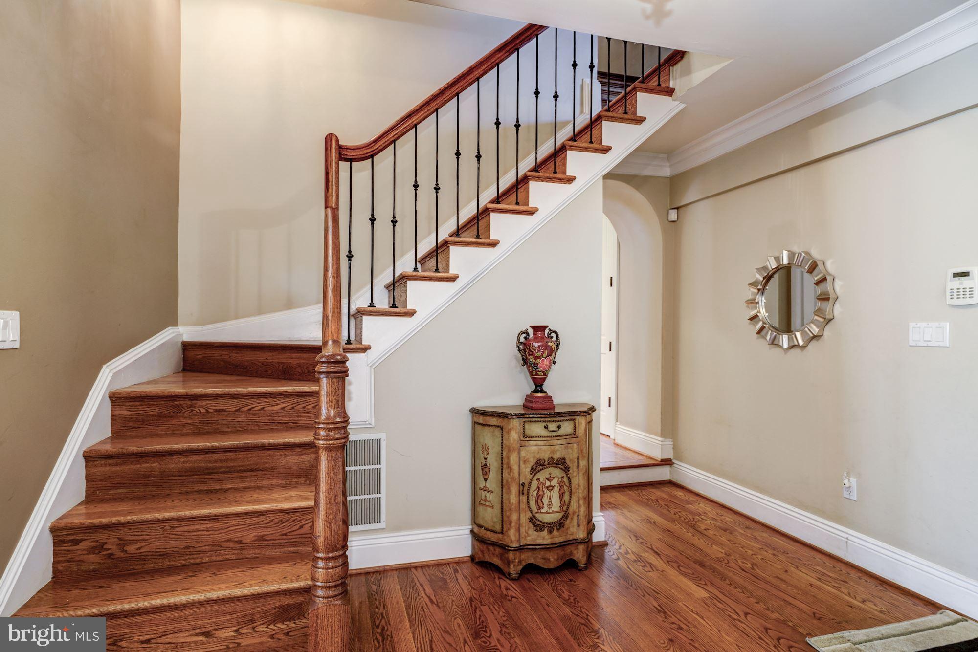 3809 Jones Bridge Road Chevy Chase, MD 20815 - Photo 31 of 70 a view of entryway and hall with wooden floor