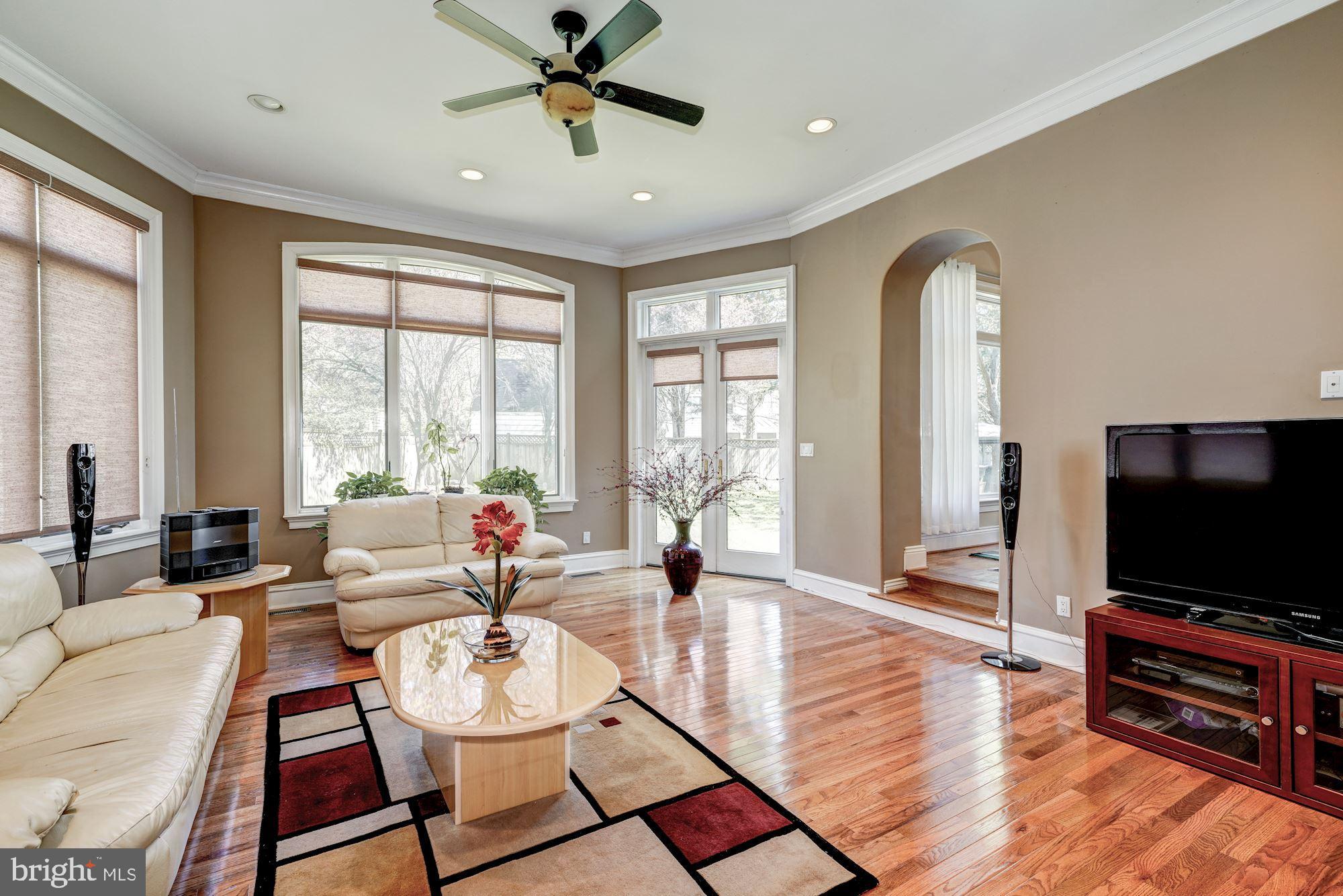 3809 Jones Bridge Road Chevy Chase, MD 20815 - Photo 34 of 70 a living room with furniture and a flat screen tv