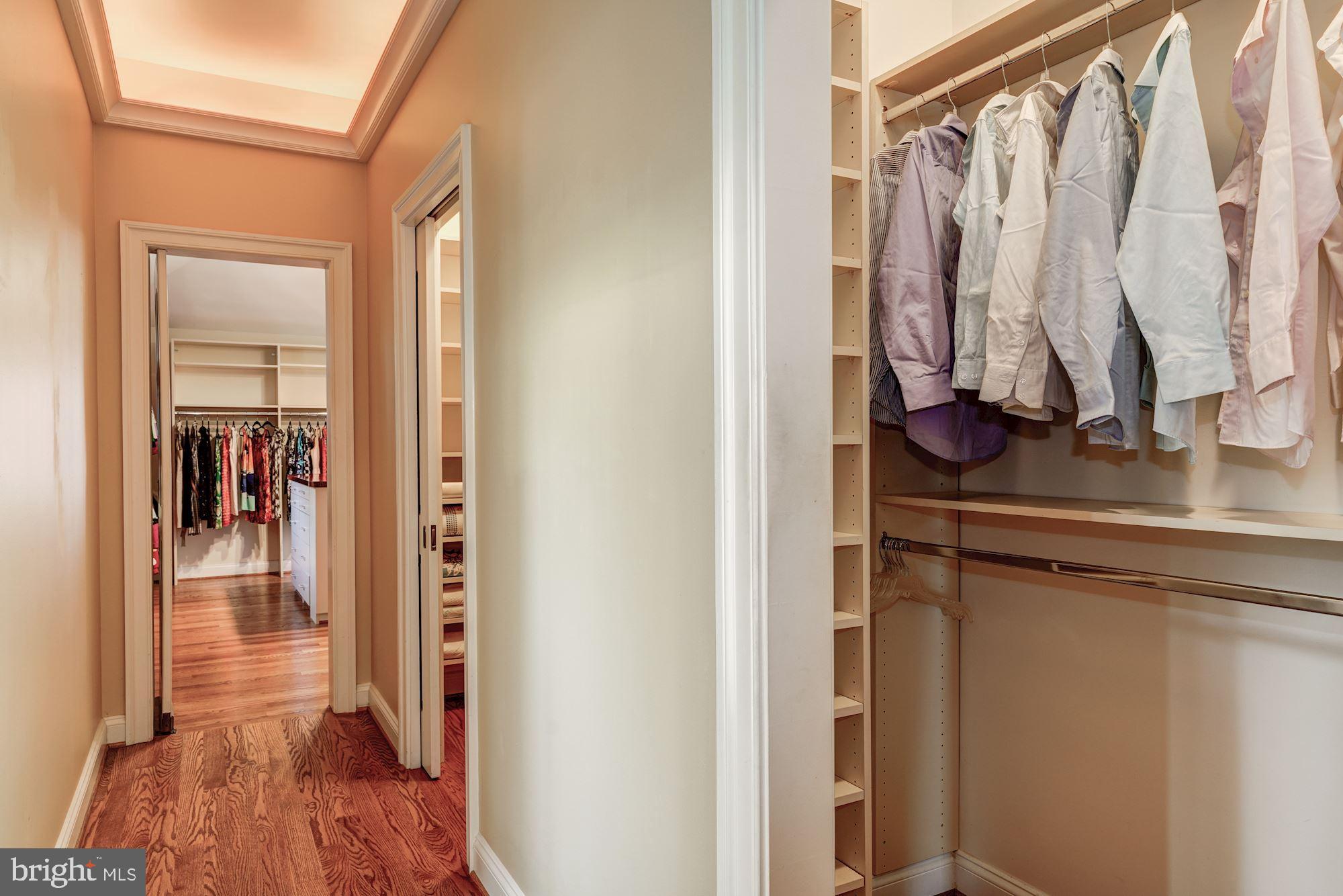 3809 Jones Bridge Road Chevy Chase, MD 20815 - Photo 39 of 70 a view of walk in closet with clothes and shoes