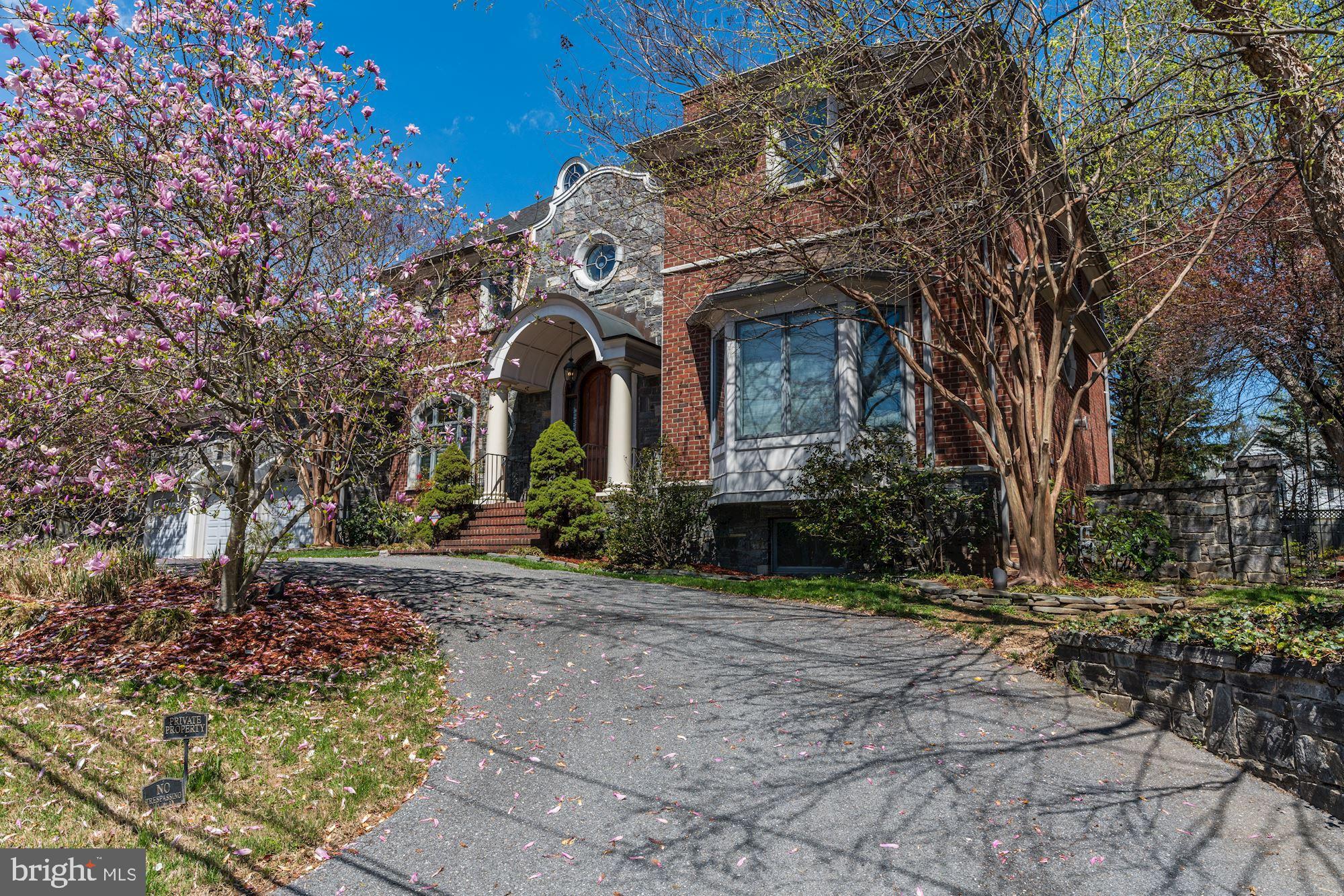 3809 Jones Bridge Road Chevy Chase, MD 20815 - Photo 4 of 70 a front view of a house with garden
