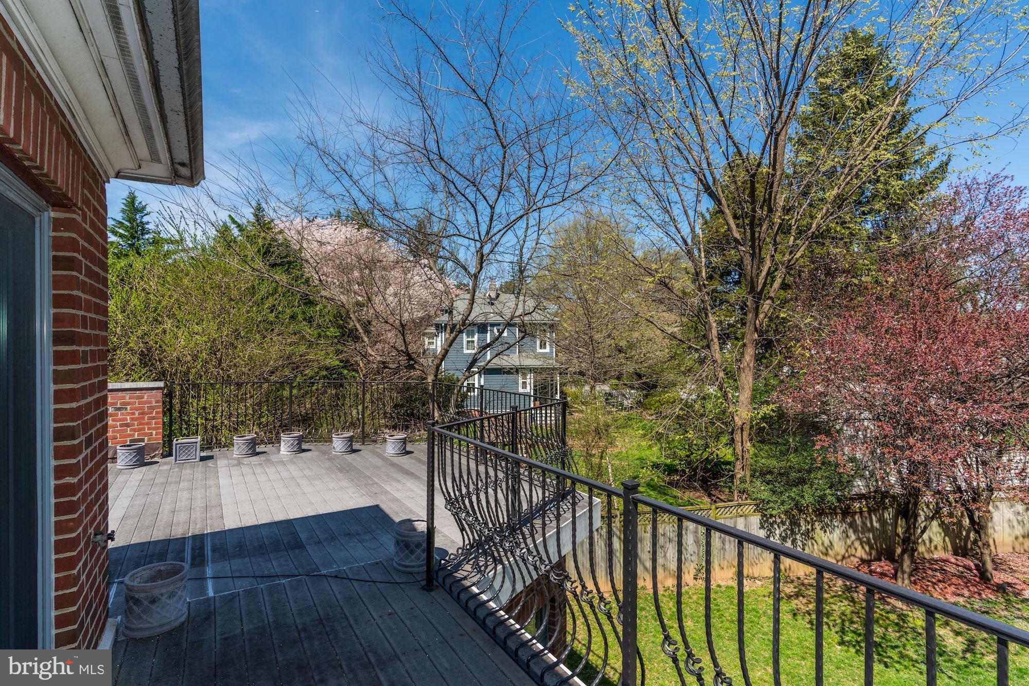 3809 Jones Bridge Road Chevy Chase, MD 20815 - Photo 50 of 70 a view of a balcony with a tree