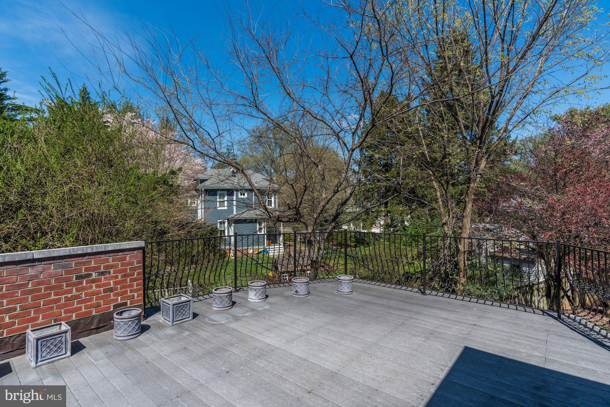 3809 Jones Bridge Road Chevy Chase, MD 20815 - Photo 51 of 70 a view of a house with a small yard