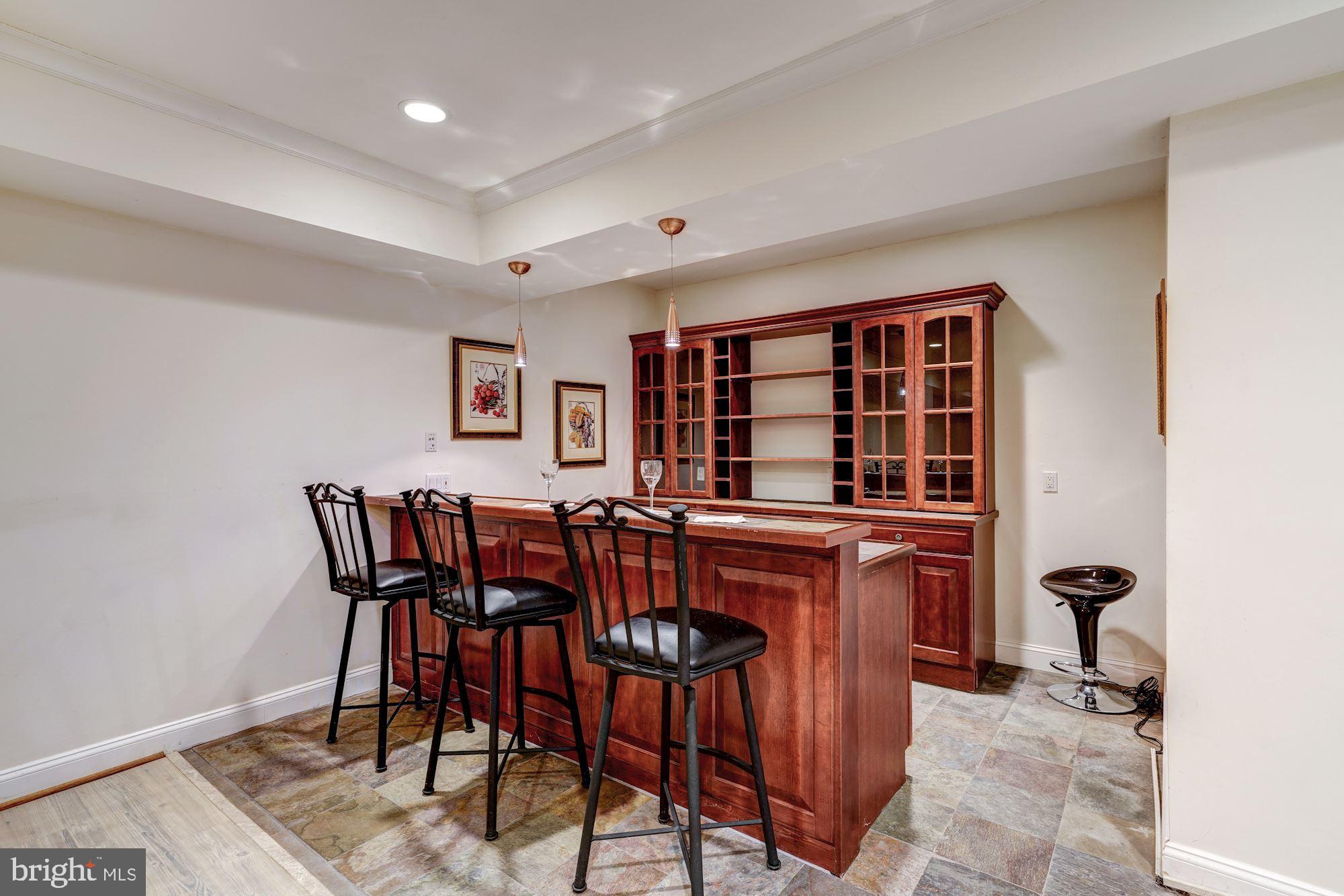 3809 Jones Bridge Road Chevy Chase, MD 20815 - Photo 55 of 70 a view of a dining room that has a table and chairs in it