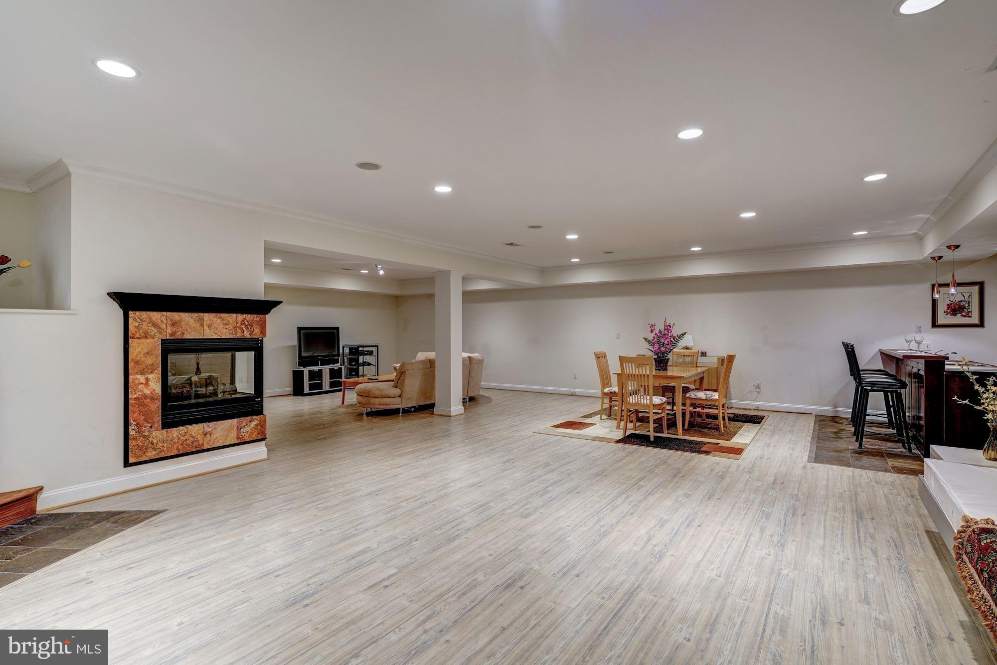 3809 Jones Bridge Road Chevy Chase, MD 20815 - Photo 56 of 70 a living room with furniture and a wooden floor