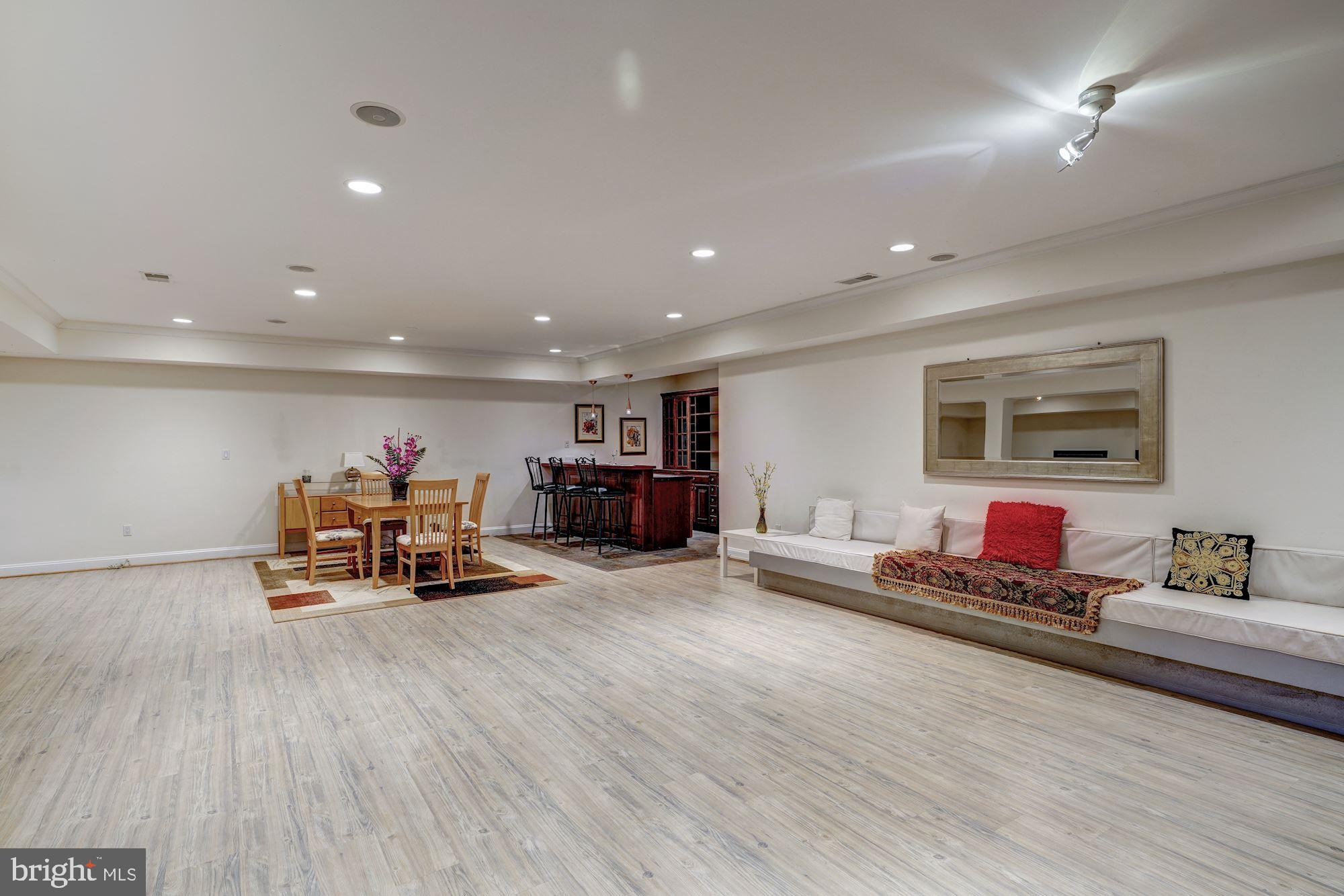 3809 Jones Bridge Road Chevy Chase, MD 20815 - Photo 57 of 70 a living room with furniture and a wooden floor