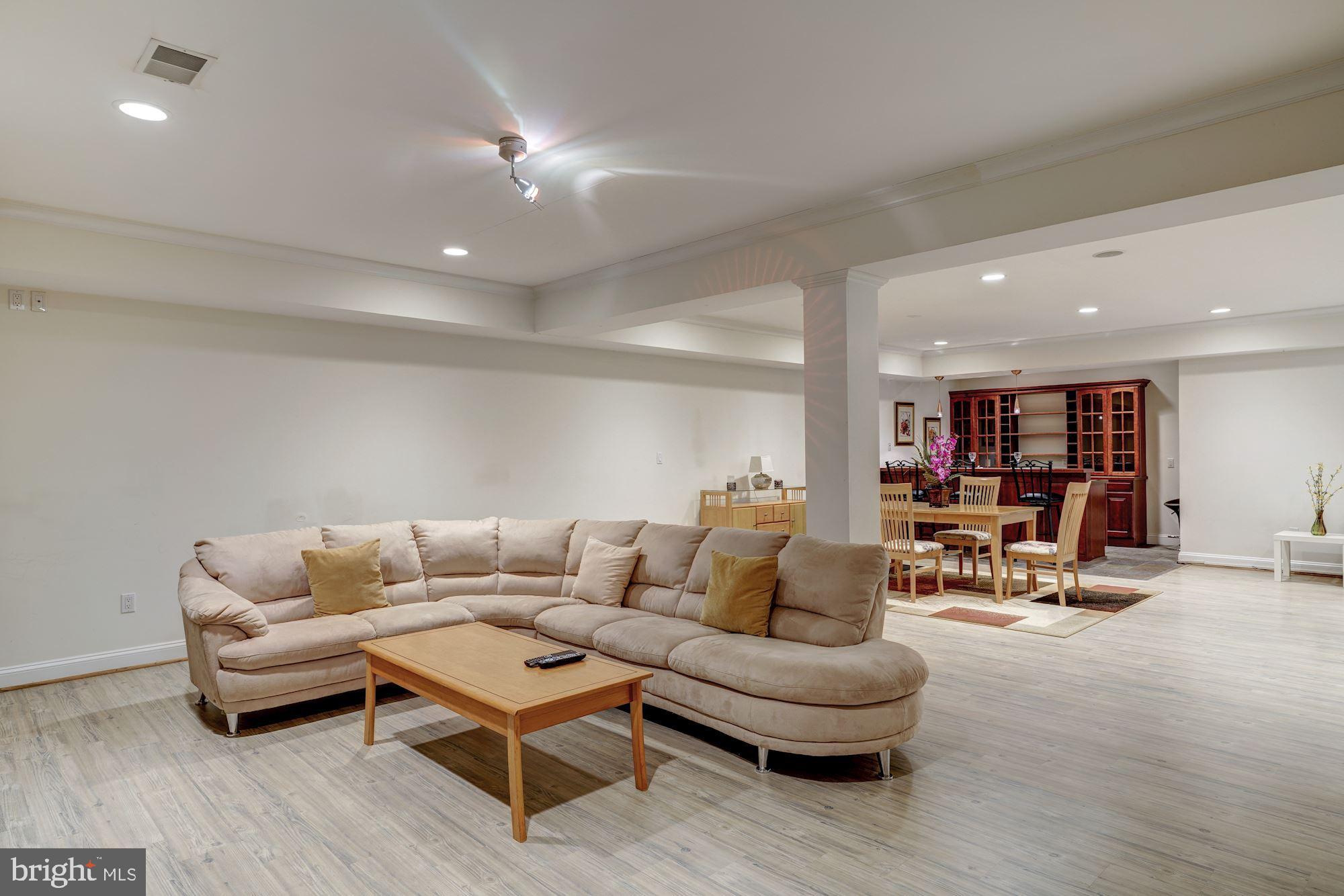 3809 Jones Bridge Road Chevy Chase, MD 20815 - Photo 58 of 70 a living room with furniture and kitchen view