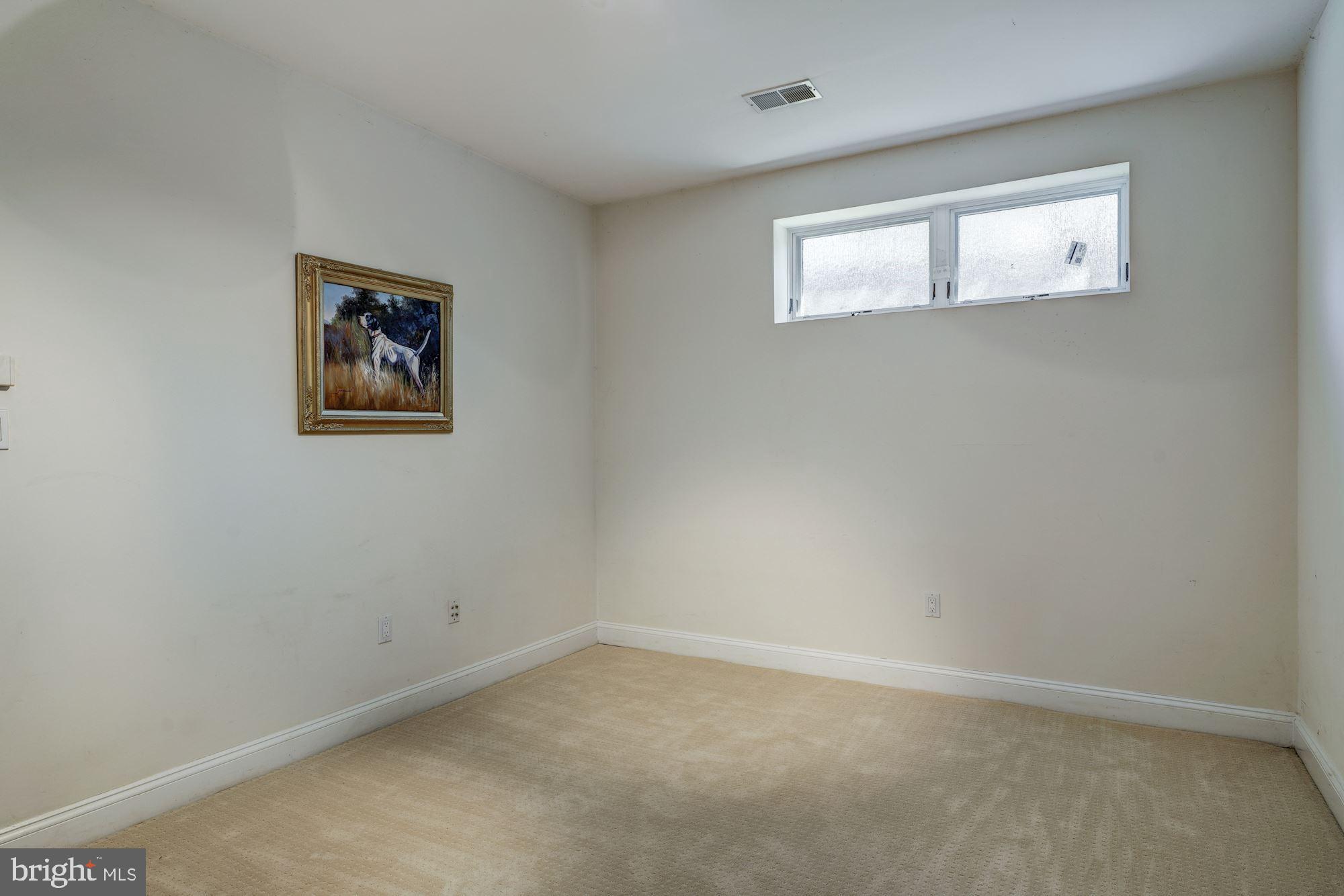 3809 Jones Bridge Road Chevy Chase, MD 20815 - Photo 59 of 70 an empty room with a window