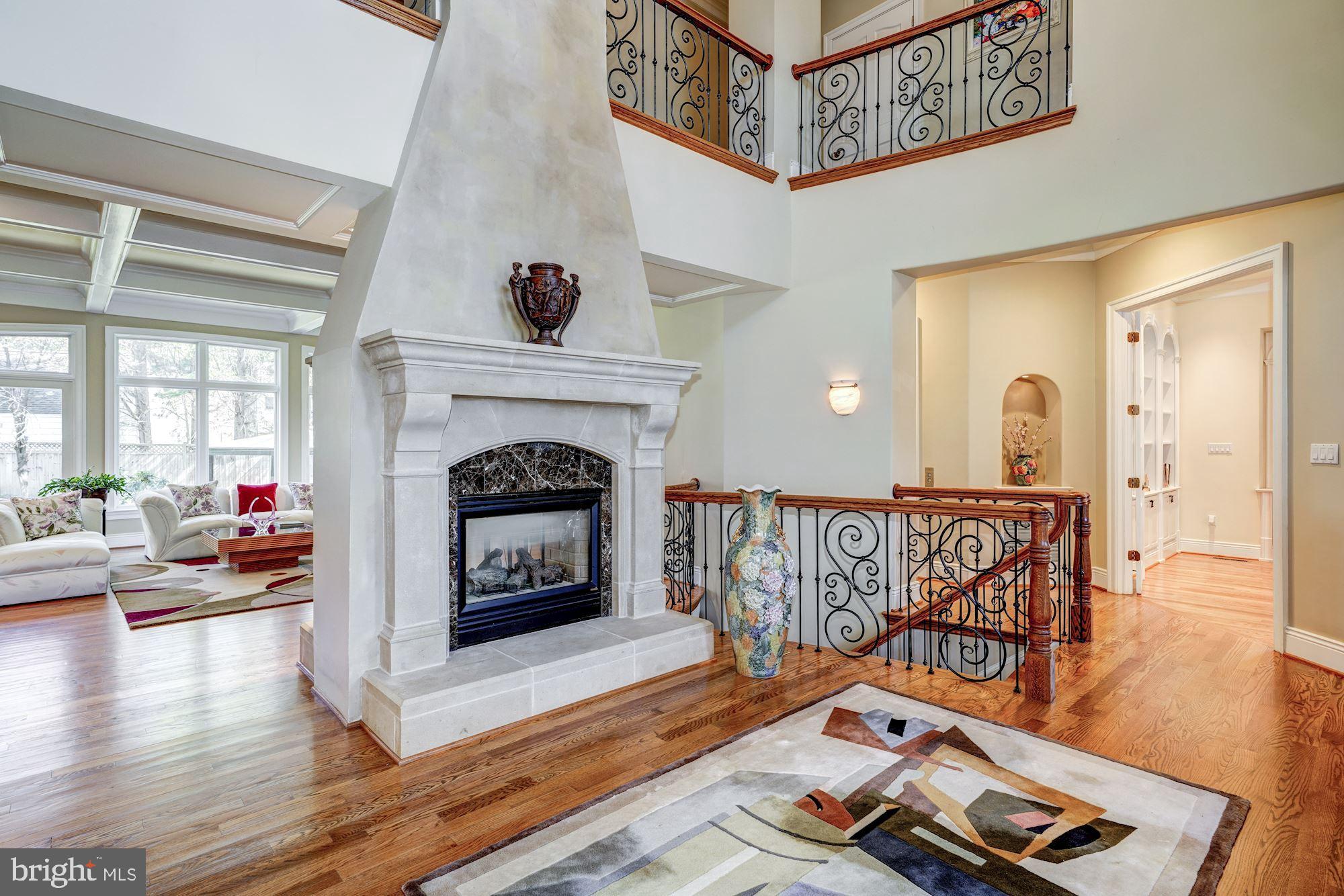 3809 Jones Bridge Road Chevy Chase, MD 20815 - Photo 6 of 70 a living room with furniture and a fireplace