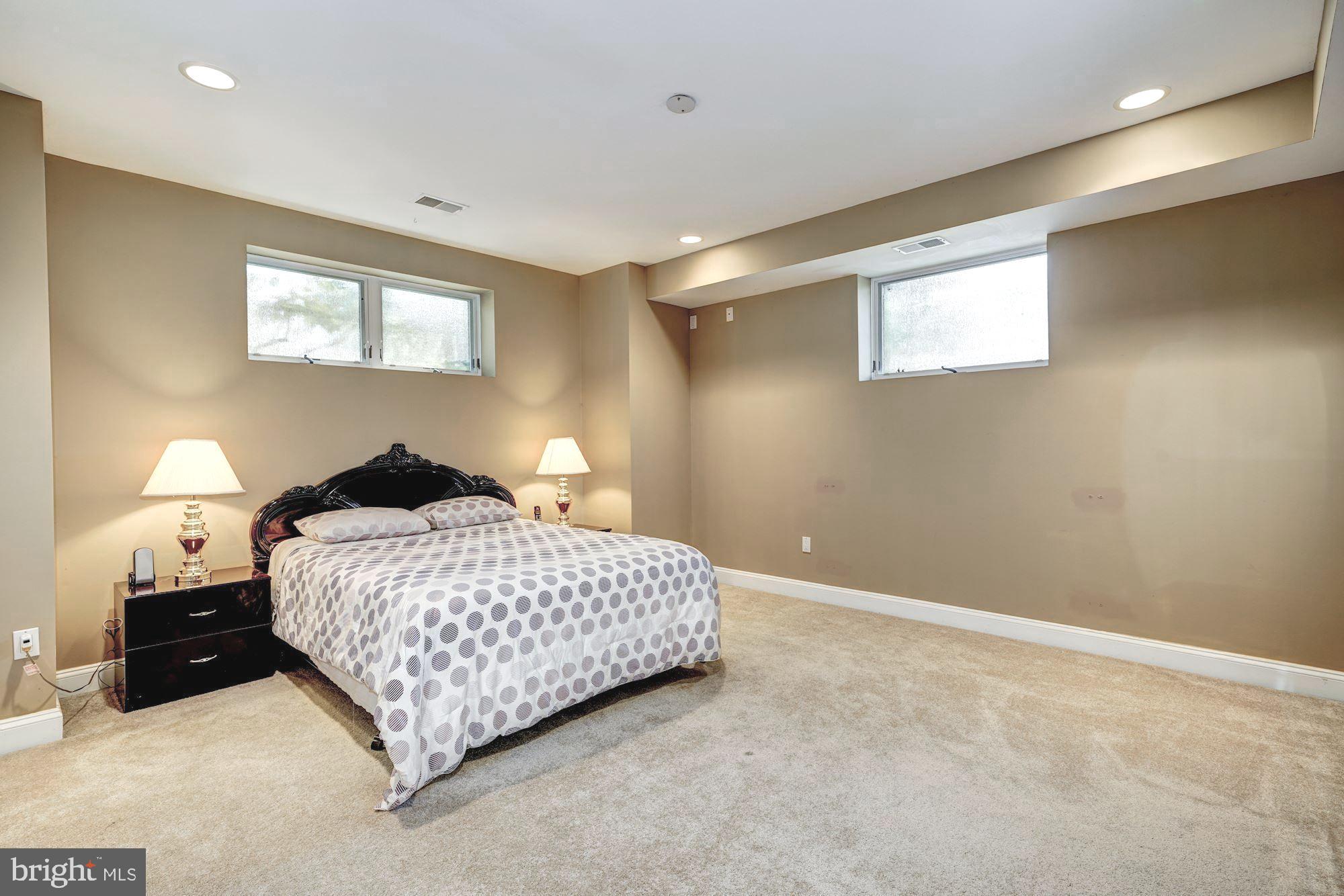 3809 Jones Bridge Road Chevy Chase, MD 20815 - Photo 61 of 70 a bedroom with a bed and a night stand