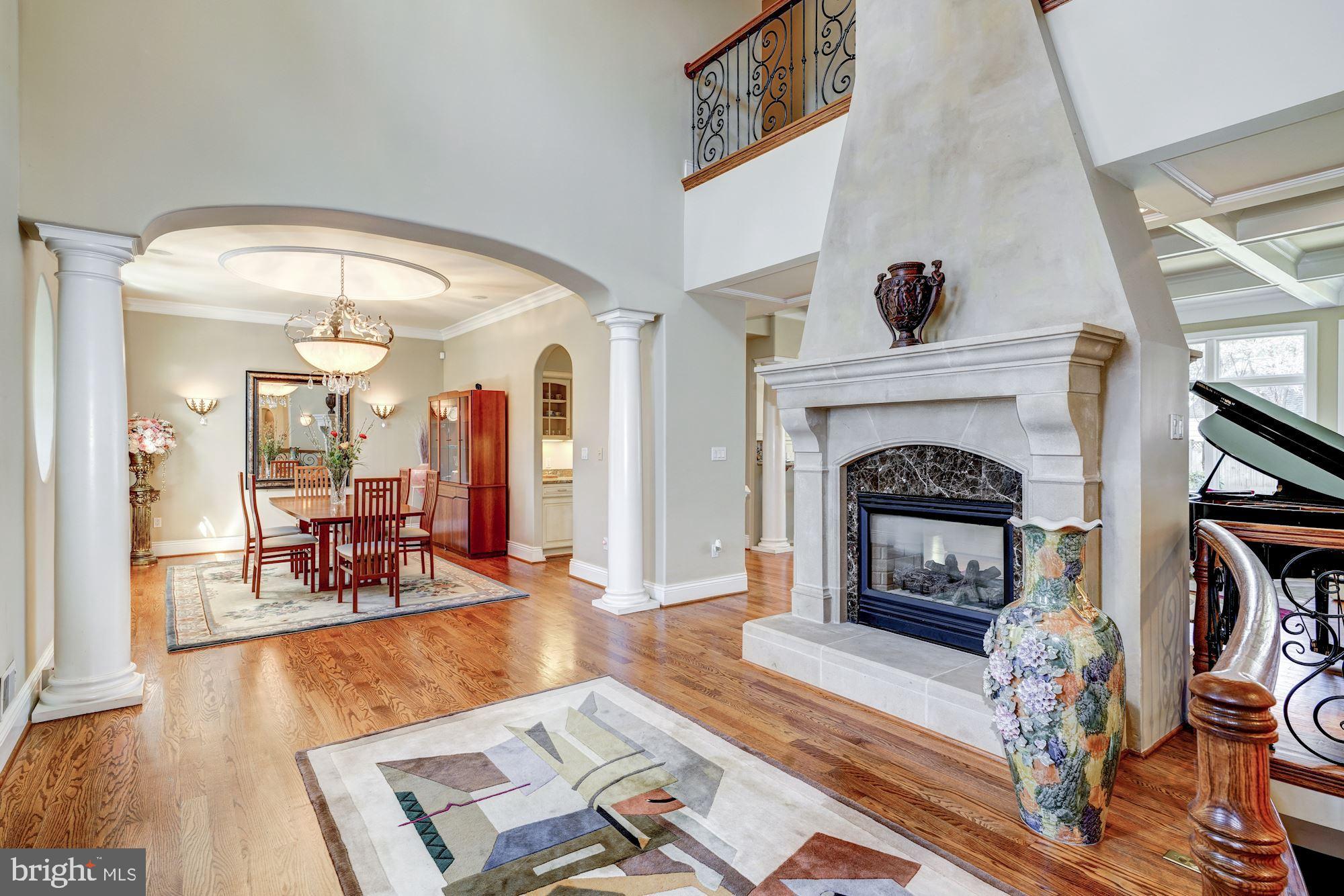3809 Jones Bridge Road Chevy Chase, MD 20815 - Photo 7 of 70 a living room with furniture and a fireplace