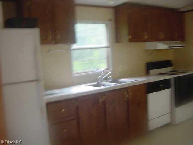 710 Flynt Road King, NC 27021 - Photo 5 of 9 Other. nice big kitchen with lots of cabinets built in desk and dining area