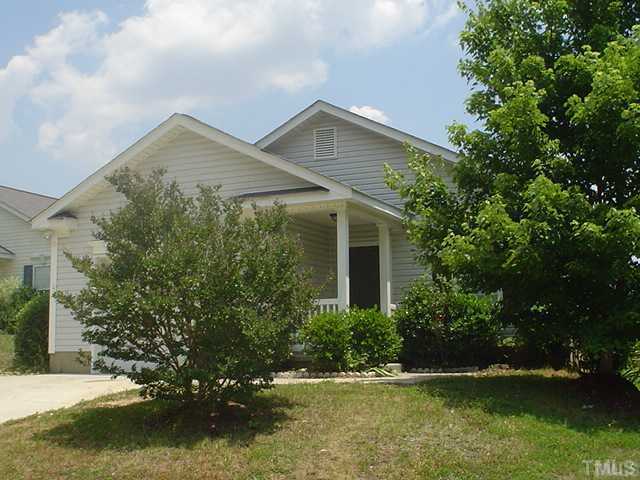 4709 Silverdene Street Raleigh, NC 27616 - Photo 1 of 15 a front view of a house with a yard and lake view