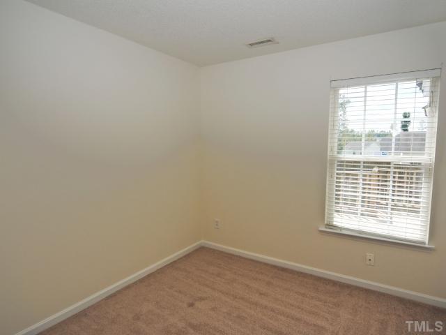 4709 Silverdene Street Raleigh, NC 27616 - Photo 12 of 15 a view of an empty room with a window