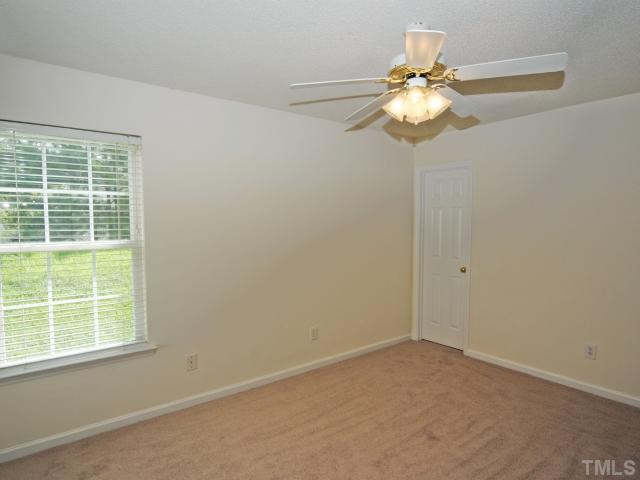 4709 Silverdene Street Raleigh, NC 27616 - Photo 14 of 15 an empty room with a window