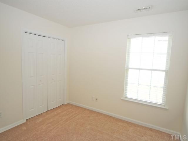 4709 Silverdene Street Raleigh, NC 27616 - Photo 15 of 15 an empty room with a window