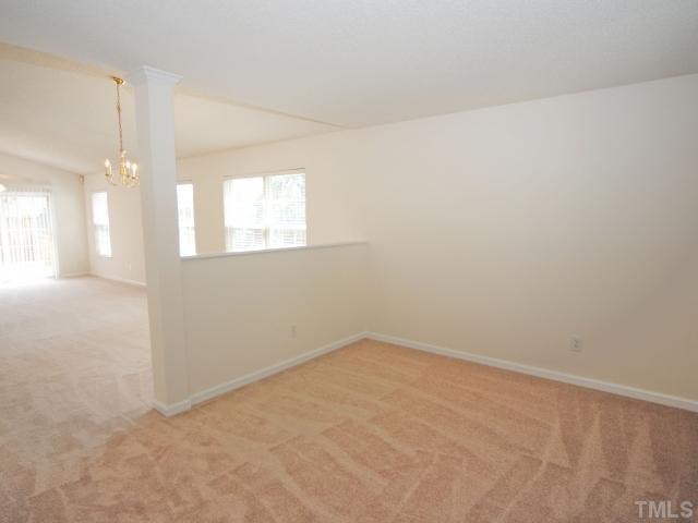 4709 Silverdene Street Raleigh, NC 27616 - Photo 5 of 15 an empty room with chandelier fan