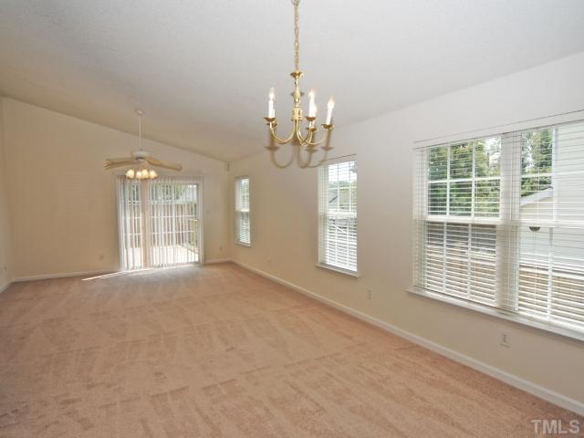 4709 Silverdene Street Raleigh, NC 27616 - Photo 7 of 15 a view of an empty room with a window