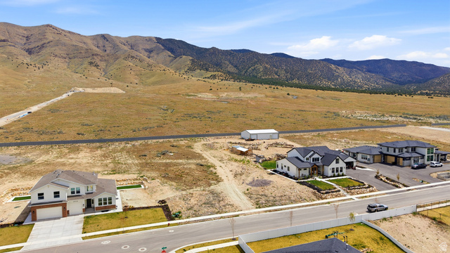 2930 Jojo Road, Unit 110 Eagle Mountain, UT 84005 - Photo 9 of 22 View of rural area with a mountainous background and nearby suburban area