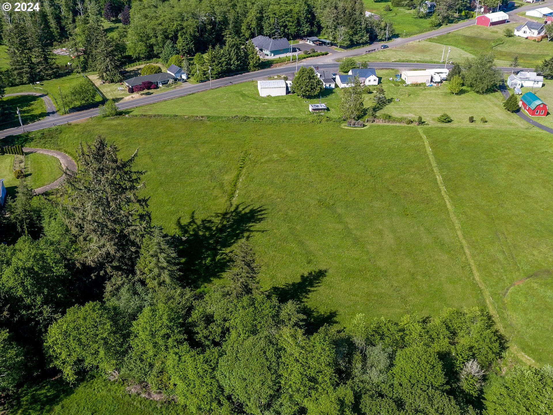 Logan Road Astoria, OR 97103 - Photo 8 of 14 a view of a golf ground with huge green field and plants