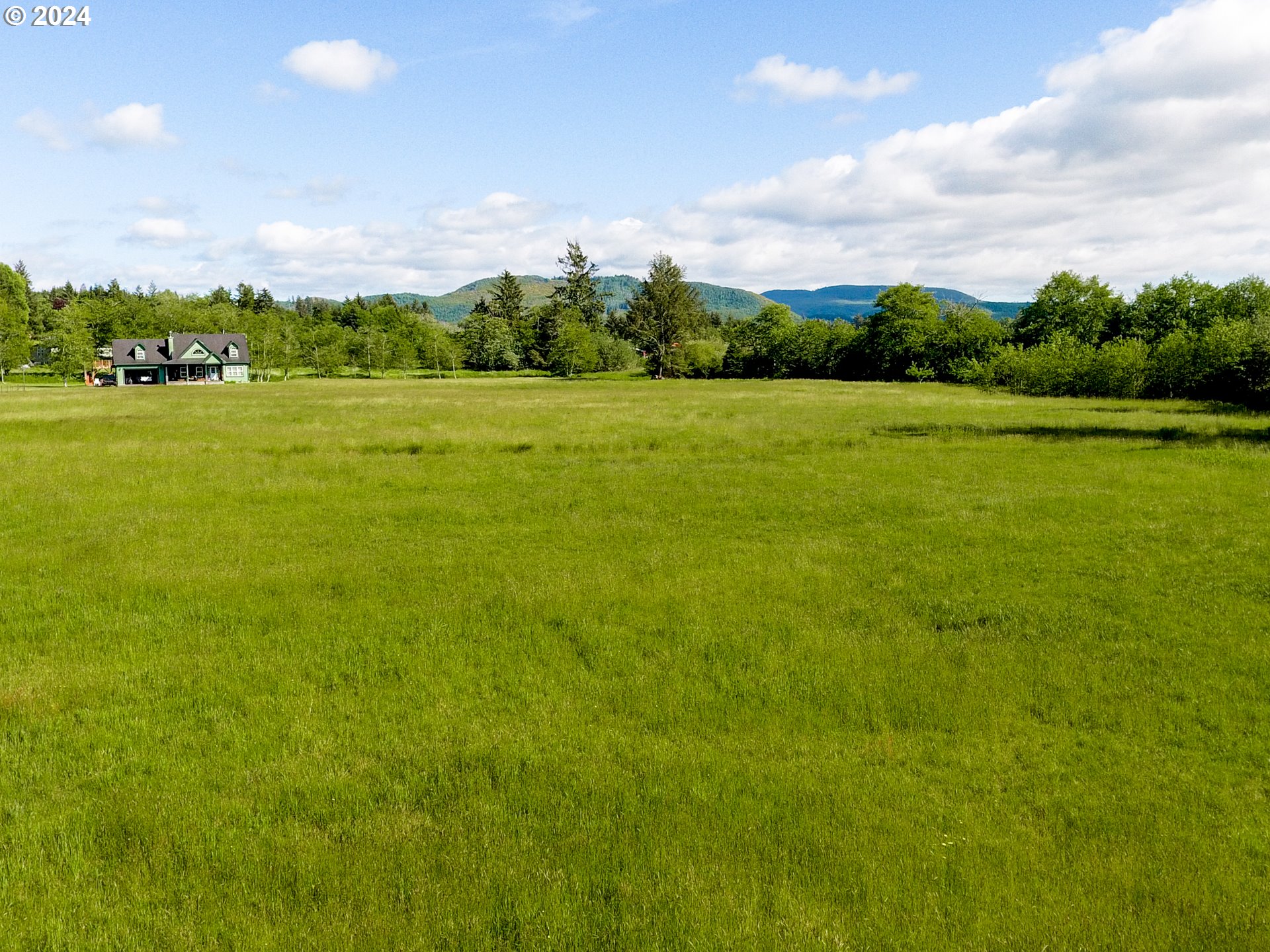 Logan Road Astoria, OR 97103 - Photo 9 of 14 a view of a big yard with floor to ceiling windows and entertaining space