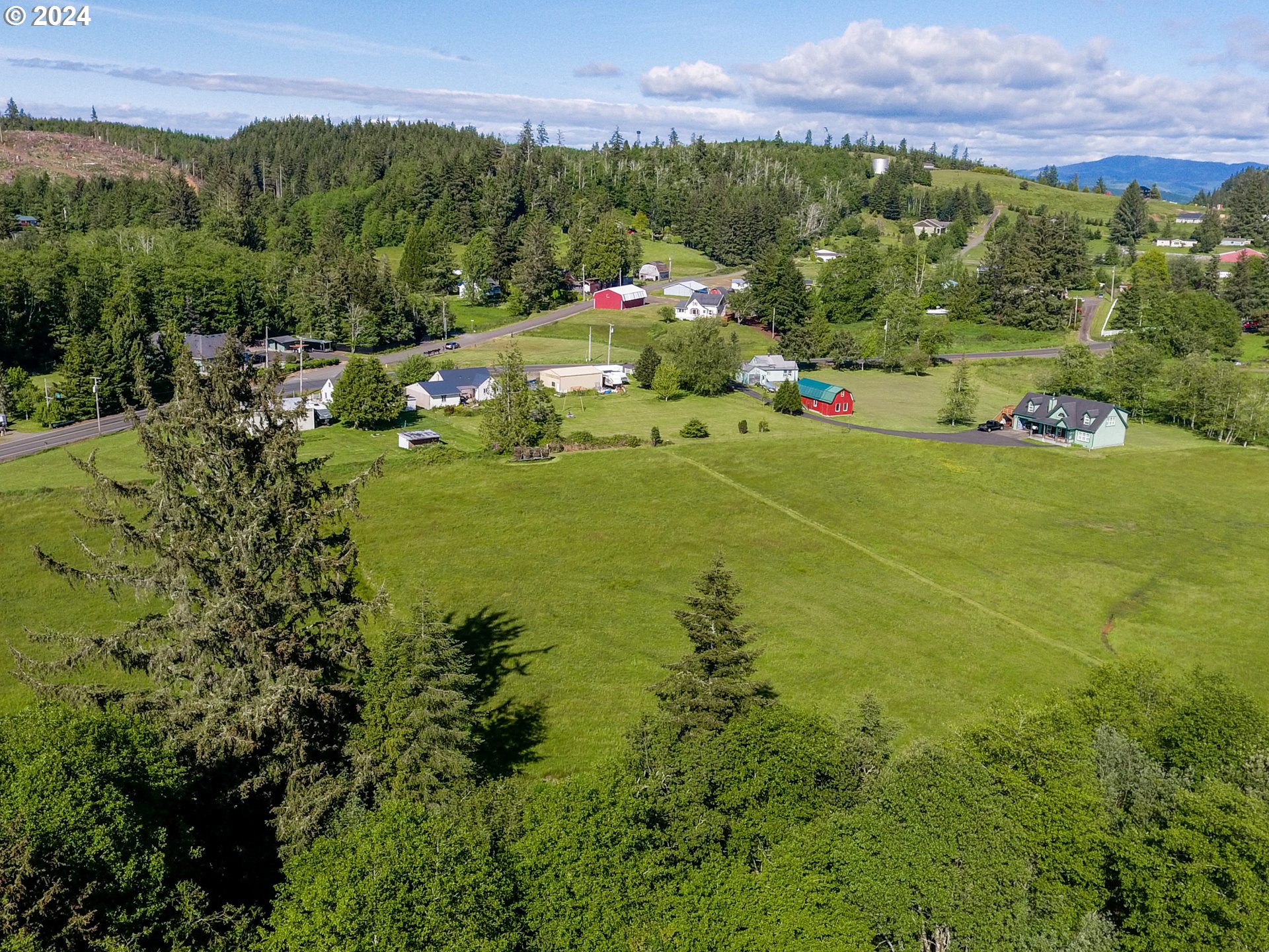 Logan Road Astoria, OR 97103 - Photo 10 of 14 a view of a town with mountains in the background