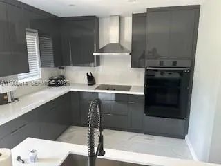a kitchen with a sink and a refrigerator
