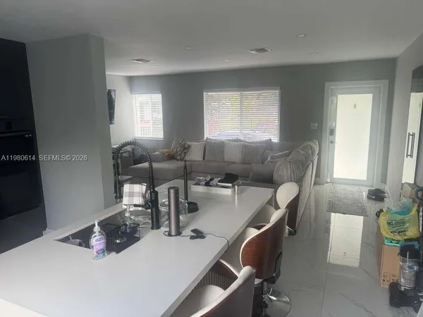 a work room with furniture and window