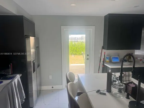 a view of a dining room with furniture window and outside view