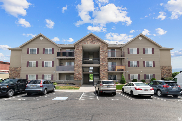 25 West Ridge Road, Unit 25 Saratoga Springs, UT 84045 - Photo 19 of 22 Multi-story building featuring tan siding and stone accents