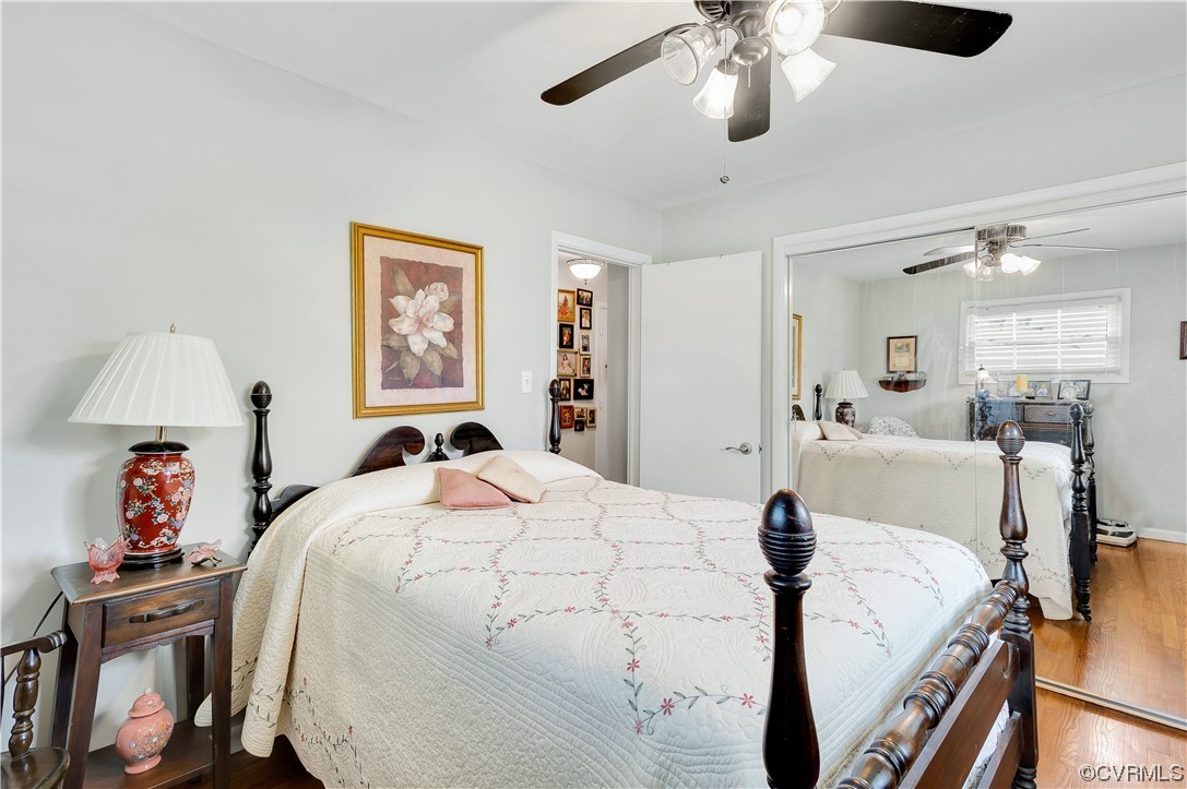 9117 Mapleview Avenue Henrico, VA 23294 - Photo 13 of 21 a bed room with a bed and a chandelier