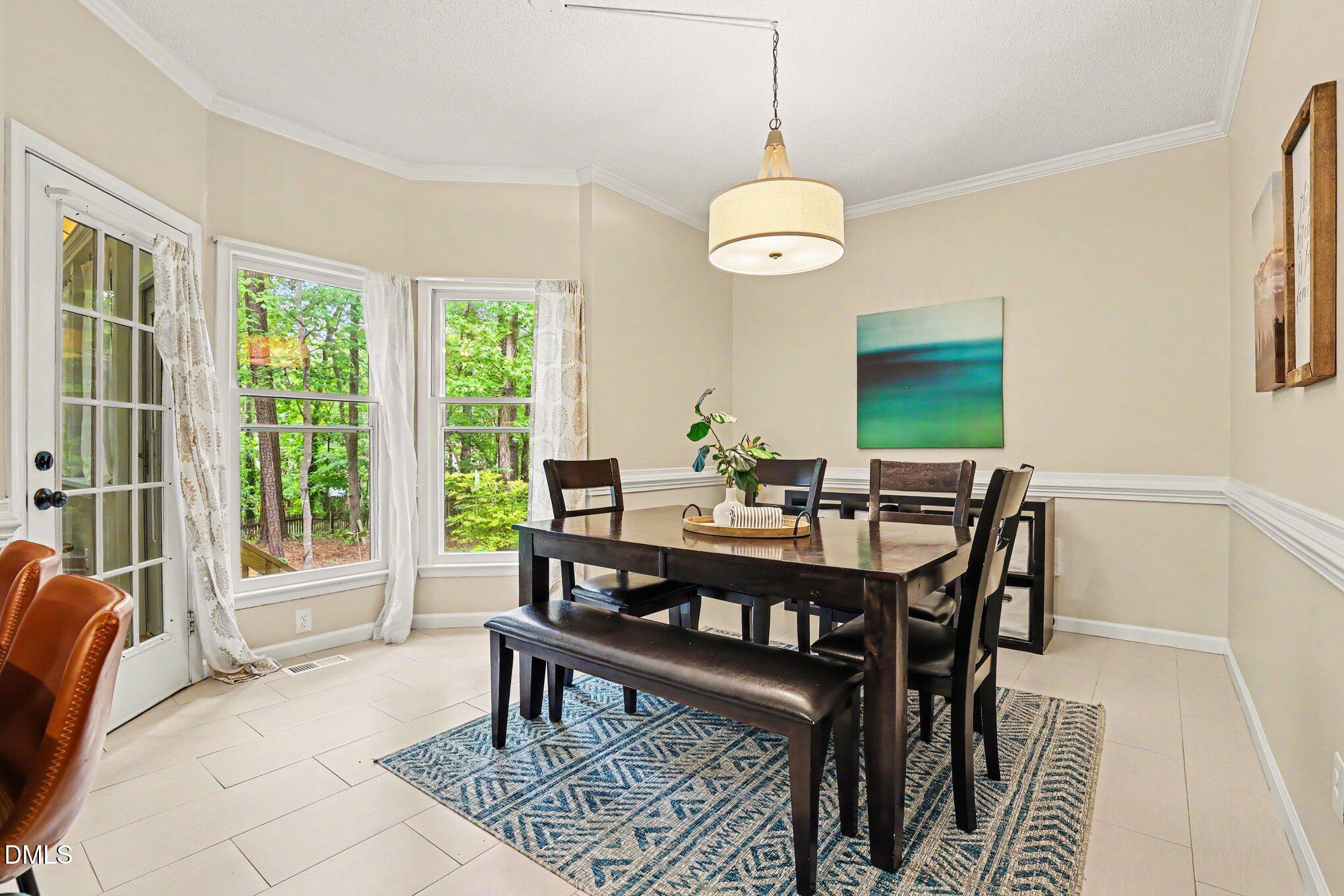 5468 Ingate Way Raleigh, NC 27613 - Photo 8 of 24 a view of a dining room with furniture window and outside view